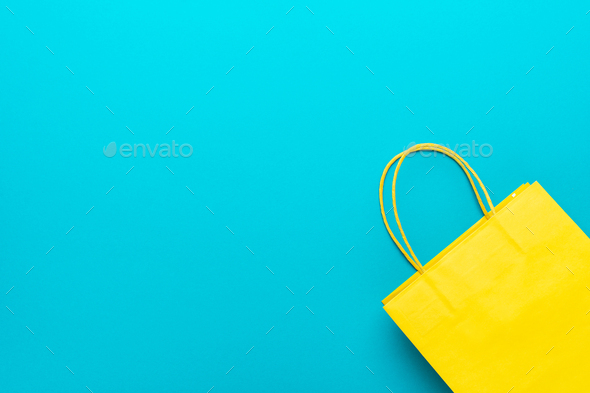 Shopping Paper Bag On Blue Background With Copy Space Summer Sale